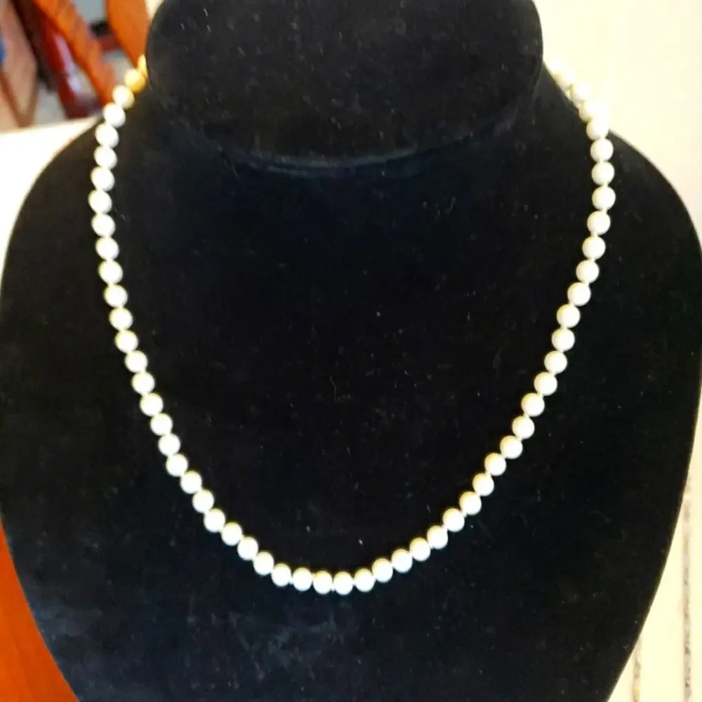 2 faux pearl necklaces 1 is NWT and beautiful toggle closure the other is longer